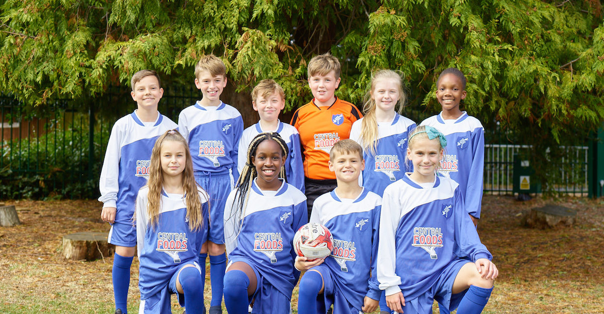 Pupils receive new football kit, thanks to Central Foods