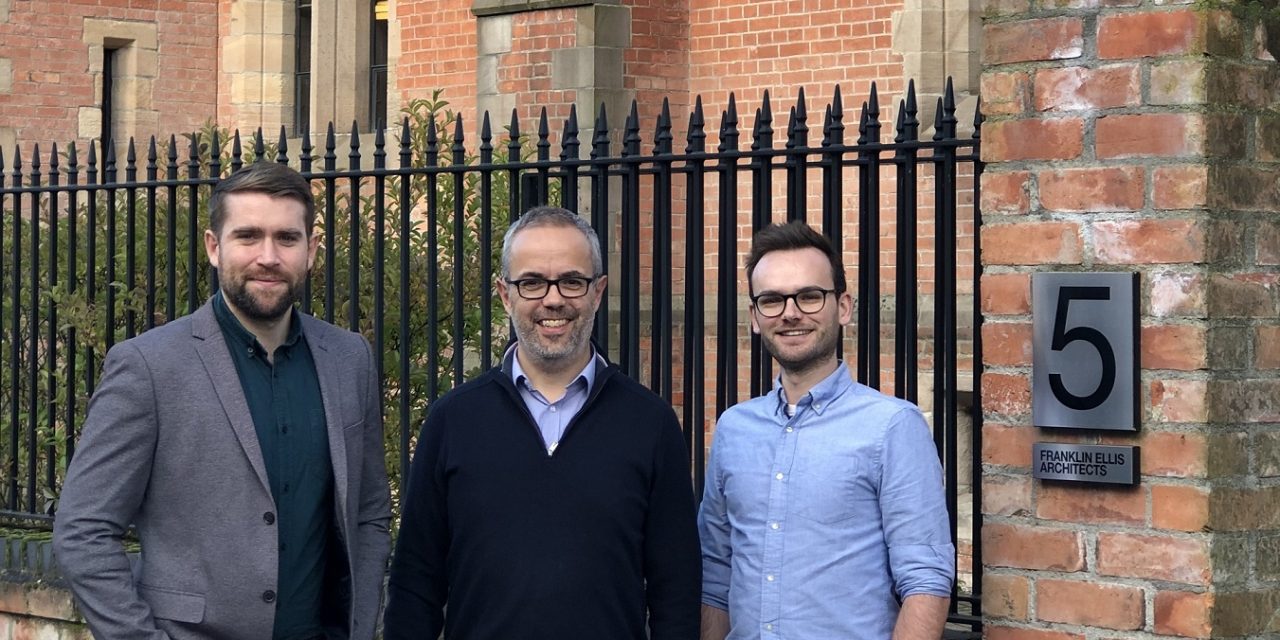Team members celebrate official qualification at Franklin Ellis Architects