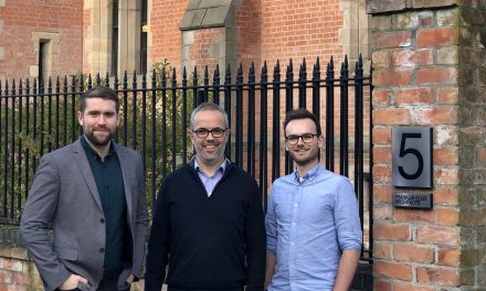 Team members celebrate official qualification at Franklin Ellis Architects