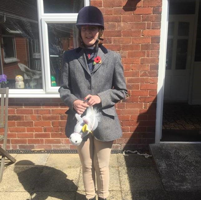 Young horse fan raises funds for local riding school with home show jumping during lockdown