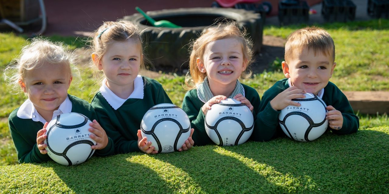 NURSERY CHILDREN SCORE DONATION OF FOOTBALLS FROM NOTTINGHAMSHIRE HOMEBUILDER