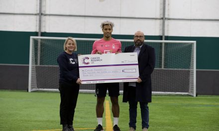 Nottingham Forest’s Lyle Taylor nets milestone cash for cancer, boosted by club sponsor UK Meds